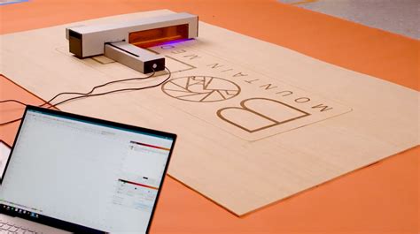 The Optic Is A Portable Laser Cutter With An Infinite Work Area