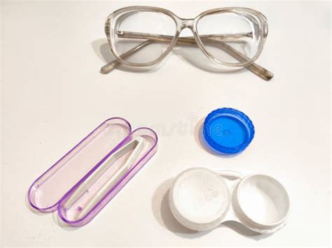 A Set For Contact Lenses With A Container Forceps Glasses The