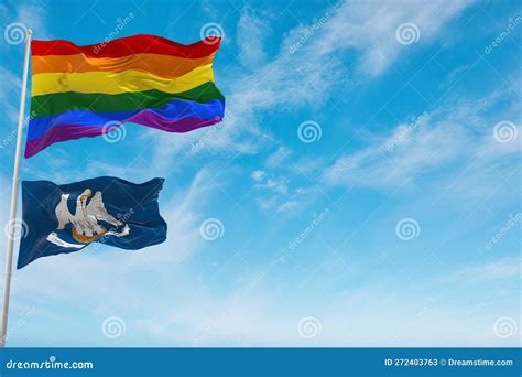 Large Lgbt Flag And Flag Of Louisiana State Usa Waving In The Wind At