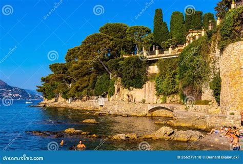 Rocky Shoreline With People Sunbathing Near Plage Paloma Beach In Saint