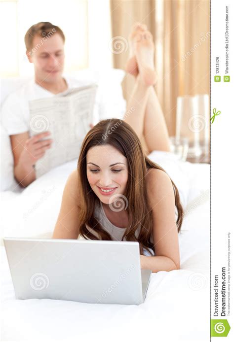 Brunette Woman With Her Husband At Home Stock Photo Image Of Browsing Couple 12813426