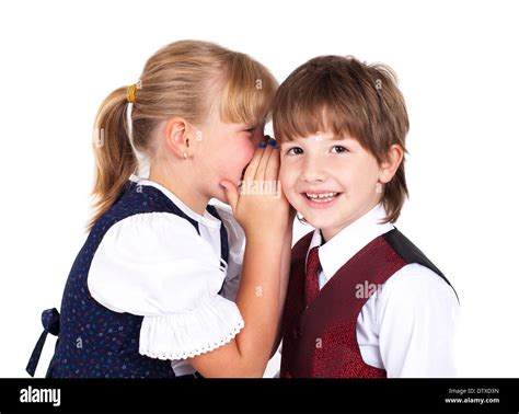 Two little kids telling secrets Stock Photo - Alamy