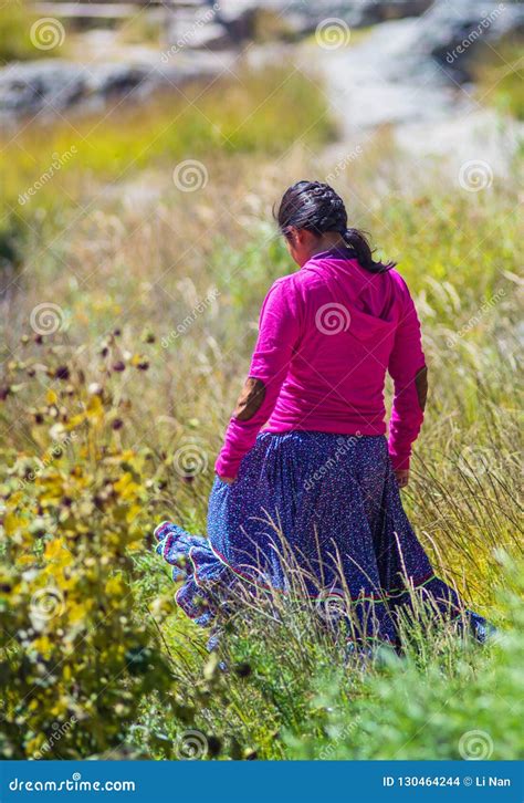 Native Indigenous Girl Walk On Grassland In Traditional Colorful Dress