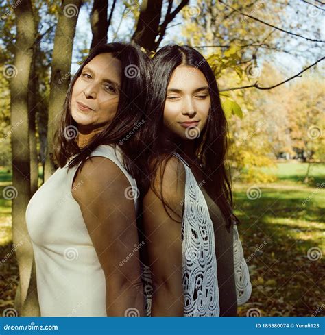 Mature Real Mother With Daughter Outside Autumn Fall In Park Stock
