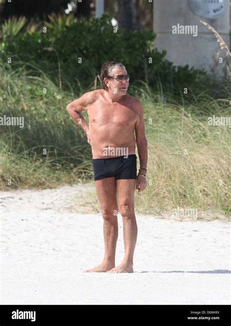 Roberto Cavalli enjoying the sunshine while on holiday with a female ...