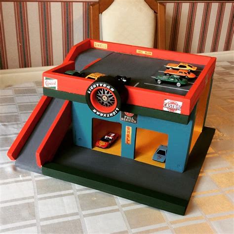 a toy car garage made out of cardboard