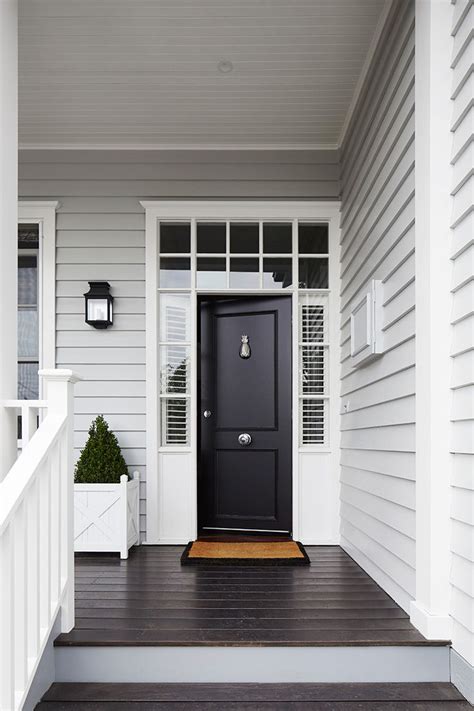 Light Grey Siding White Trim Around Windows And Front Door Black