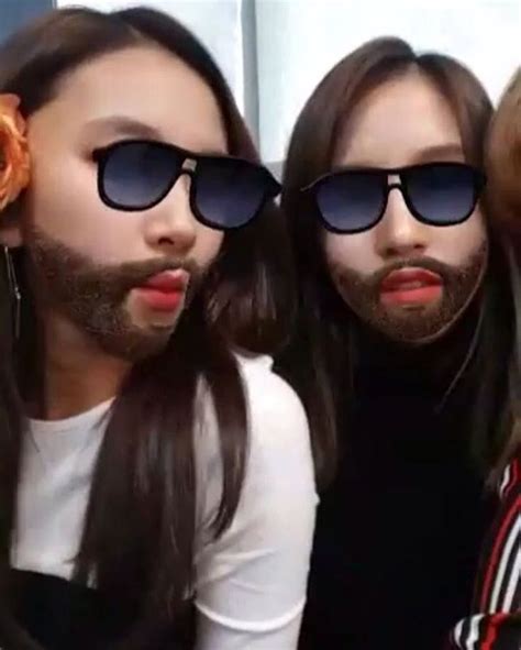 Three People With Long Hair And Sunglasses Are Posing For The Camera