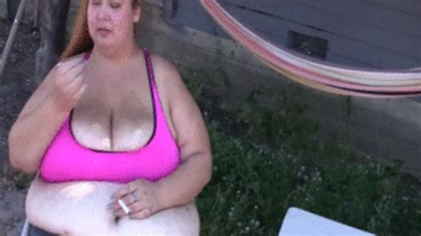 BBW Lola LoveBug Is Smoking Outdoors Sitting In Chairs And Blowing Smoke On Her Big Tits The