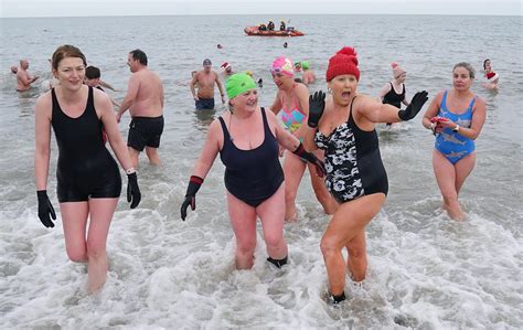 Incredible gesture as sea swimmers brave cold for New Year's Day