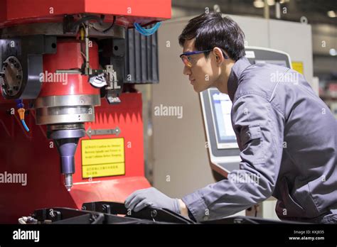 Confident Chinese Engineer Working In The Factory Stock Photo Alamy