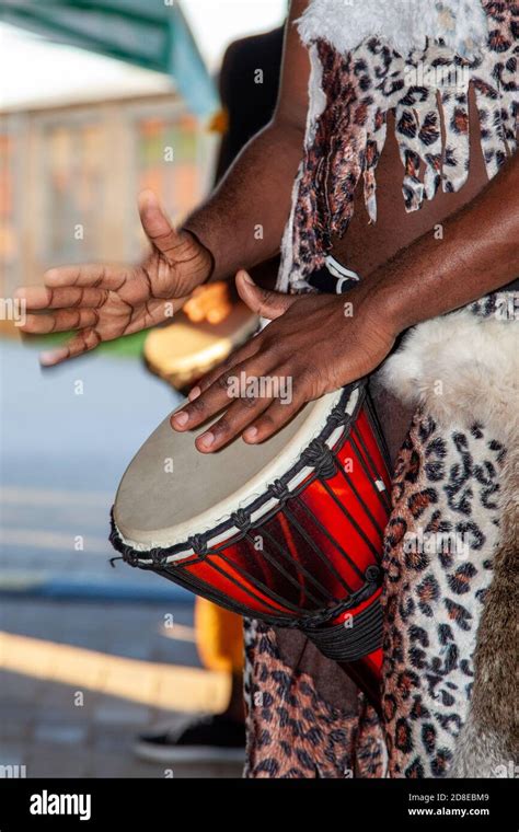 An African drummer plays the djembe Stock Photo - Alamy