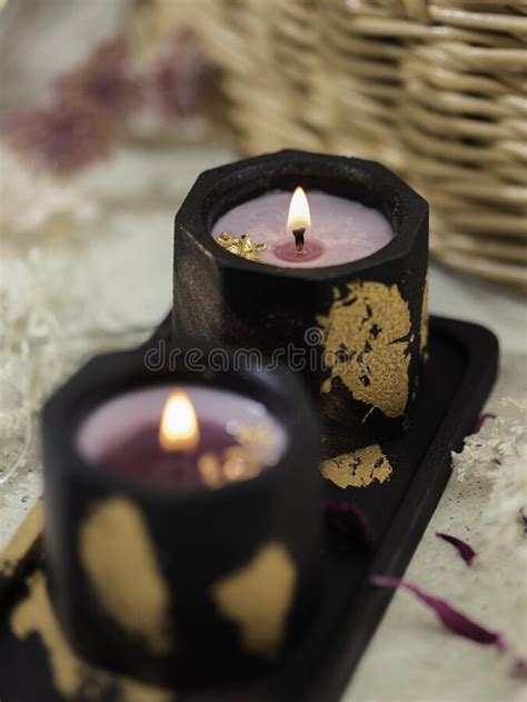 Black Candlestick Made Of Plaster With Soy Wax On Light Background