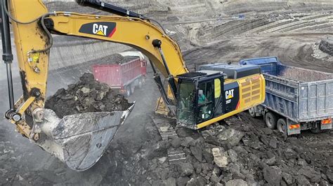 Caterpillar F Excavator Loading Mercedes And Man Trucks Youtube