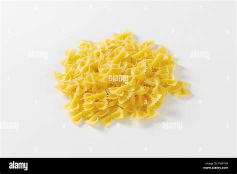 Heap Of Uncooked Bow Tie Pasta Stock Photo Alamy