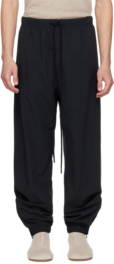 Fear of God ESSENTIALS: Black Drawstring Track Pants | SSENSE