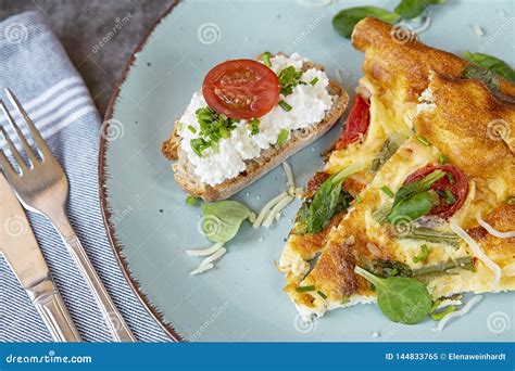 Sliced Pieces Of Omelet With Bread On A Plate Omelet In The Oven With