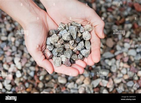 Close Up Of A Persons Hand Holding A Stones Stock Photo Alamy