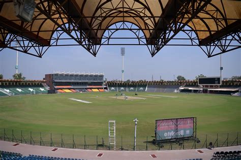 Ground staff prepare the pitch of the Gaddafi Stadium | ESPNcricinfo.com