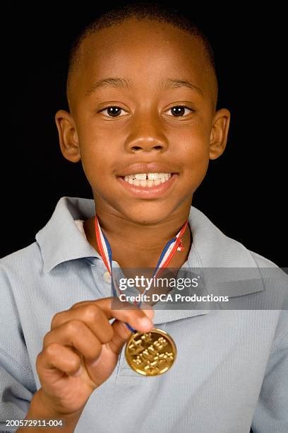 boy wearing medal   premium high res pictures getty images