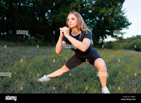 Athletic Blonde With A Slim Figure Performs Strength Exercises For Squats Stock Photo Alamy