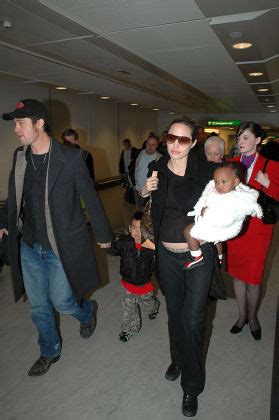 Count Brad Pitt And Angelina Jolie Arriving At Heathrow Airport