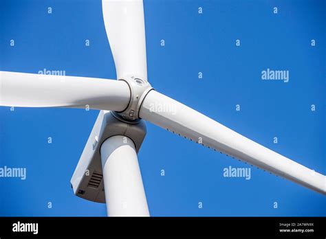 Wind Turbines Generating Electricity With Blue Sky Close Up Of Wind