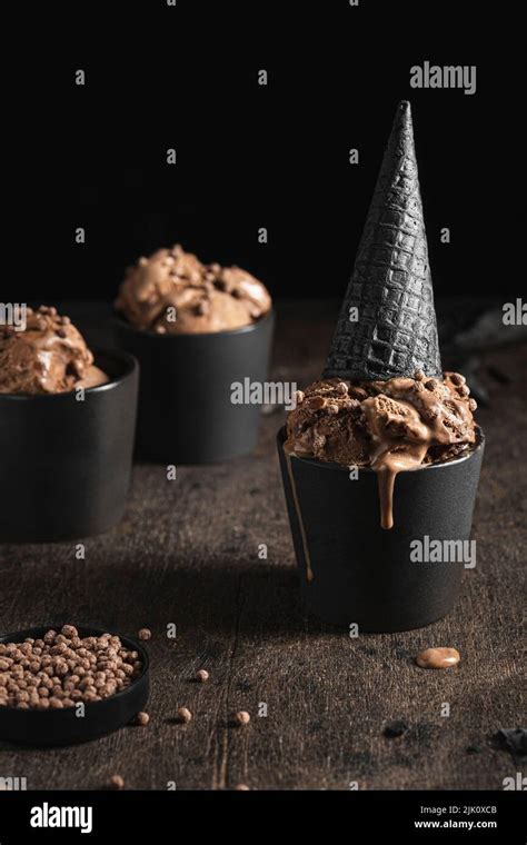 Chocolate Ice Cream With Black Waffle Cone Stock Photo Alamy