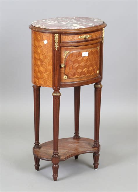 An Early Th Century French Parquetry Kingwood Oval Bedside Cabinet