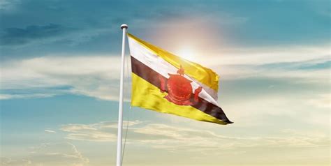 Premium Photo Brunei National Flag Waving In Beautiful Sky