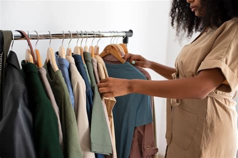 Free Photo Side View Woman Looking At Clothes