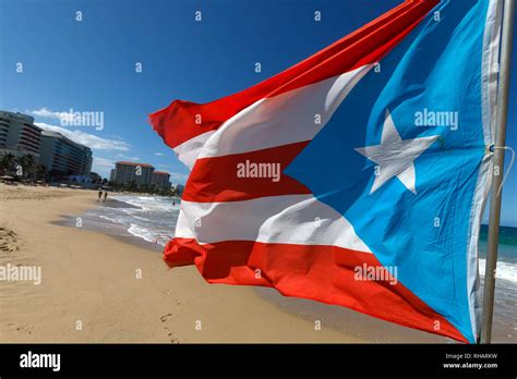 A Puerto Rican flag flying on the beach in Condado, San Juan, Puerto Rico Stock Photo - Alamy