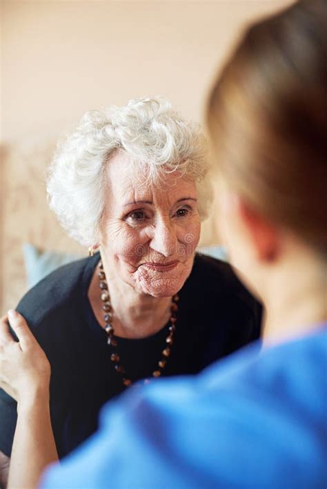 Elderly Woman And Happy With Caregiver For Support In Nursing Home