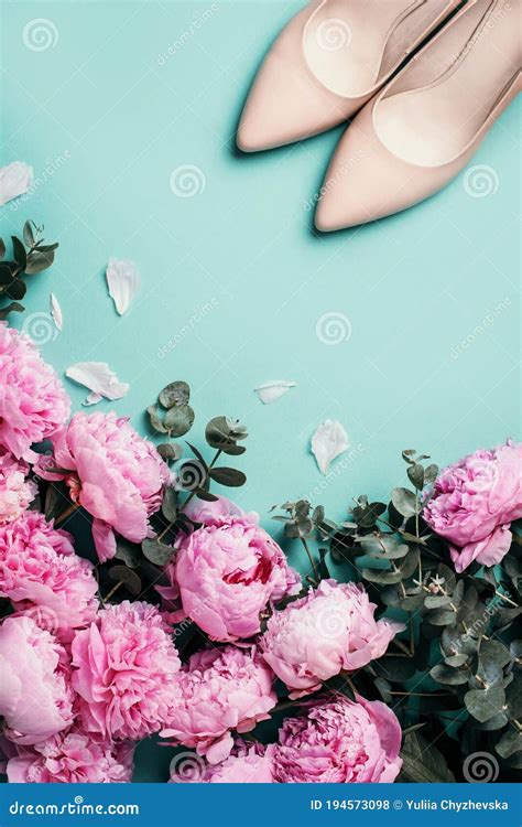 Woman Nude Shoes Pastel Pink Peonies Eucalyptus Flowers On Pastel Blue Background Flat Lay