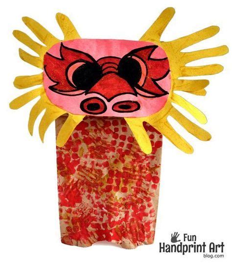 Paper Bag Chinese Dragon Puppet Made With Handprints Chinese New Year