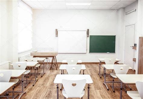 Classroom with chairs and desks — Stock Photo © belchonock #139547382