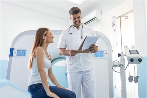 Premium Photo Male Doctor Giving Information To Woman Before Mri Scan