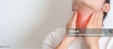 woman checking thyroid gland disease hand holding neck pain
