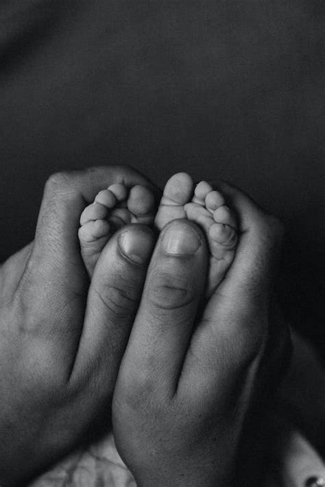 Hands Holding Baby Feet · Free Stock Photo