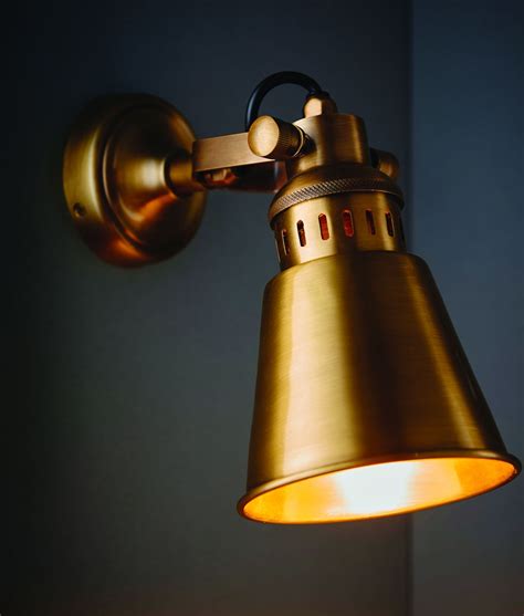 Adjustable Wall Light In Solid Antique Brass