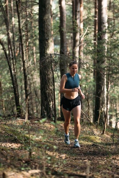 Premium Photo | Fitness woman trail runner running on sunrise in summer ...