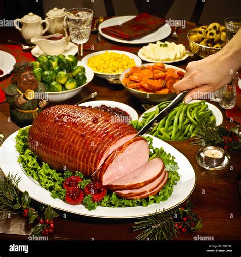 Female Hand Cutting Spiral Cut Ham Dinner Vegetables Garnish Stock