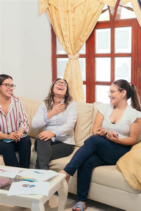 Cheerful Latina Women Discussing While Enjoying Themselves At The Office Stock Image Image Of
