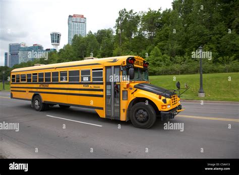 Yellow Bluebird Canadian School Bus On Road At Niagara Falls Motion