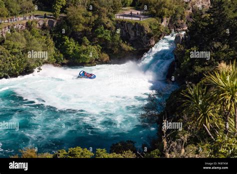 A jet boat with tourists races close to Huka Falls - most visited ...