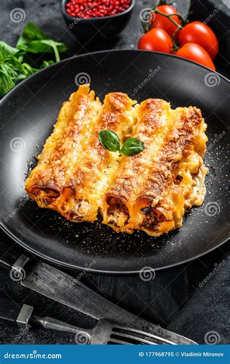 Italian Homemade Pasta Cannelloni With Beef And Tomato Sauce Black