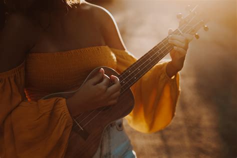 Close Up Shot Of A Person Playing Ukulele · Free Stock Photo