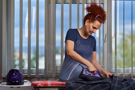 Mature Housewife Ironing Clothes Stock Photo Image Of Headband Mature 274742276
