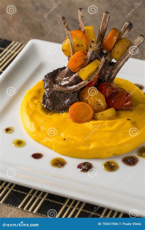 A Dish Of Rack Of Lamb With Mashed Cassava And A Glass Of Wine O Stock