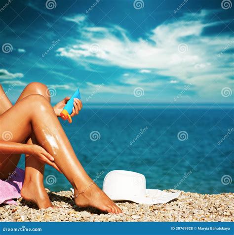 Tan Woman Applying Sunscreen On Legs Stock Photo Image Of Protection